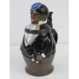 A 19thC unusual figural ceramic beer stein, the pewter collar marked LBCM (Leo Lindenblatt