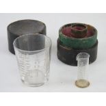 A medicine glass and minim measure by Barclay & Sons Ltd London in original fitted leather box.