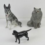 A Beswick figurine of a grey Persian cat together with a Beswick black Labrador and another