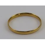 A 22ct gold ring, plain D shaped band hallmarked for Birmingham, size N-O, 1.4g.
