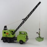 A vintage Louis Marx & Co crane toy bearing Lumar contractors decals upon.