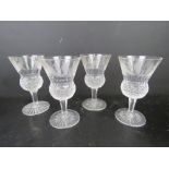 A set of four etched Scottish lead crystal glasses of thistle form having etched thistle design