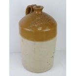 A large salt glazed stoneware jug 'J M Vernon Northampton & Towcester', 48cm high