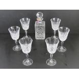 A Thomas Webb square shaped lead crystal decanter having label upon, together with six cut glass
