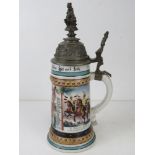 A military themed ceramic beer stein having Hussar on horseback with crest to handle,