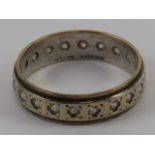 A 9ct gold eternity ring hallmarked Birmingham 1965 set with white stones (possible spinel) size O-