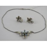 A suite of jewellery by Krementz comprising necklace and earrings in floral design. Within vintage