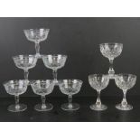 A set of six etched glass champagne saucers together with a set of three cut glass champagne