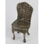 A Victorian silver miniature chair hallmarked for Birmingham 1897 weighing 26.2g, 6cm at back.
