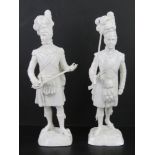 A pair of Sitzendorf German porcelain Scottish military figurines in traditional 18thC dress,