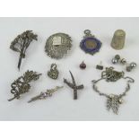 A quantity of silver and costume jewellery including marcasite brooch, Jerusalem brooch,