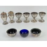 A quantity of silver plated table condiments including a pair of small sugar sifters with gilt