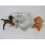 A Beswick figuring of a foal together with a ceramic figurine of a dog marked England and number