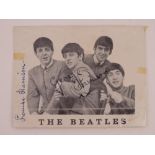 An Official Beatles Fan Club monochromatic photocard bearing the signature of George Harrison upon.