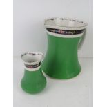 A Bisto England ceramic wash jug with matching bud vase in green and white ground with black