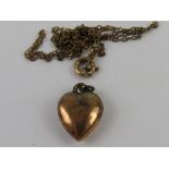 An Edwardian heart pendant stamped indistinctly (9ct?) on chain stamped 9ct (chain a/f), total