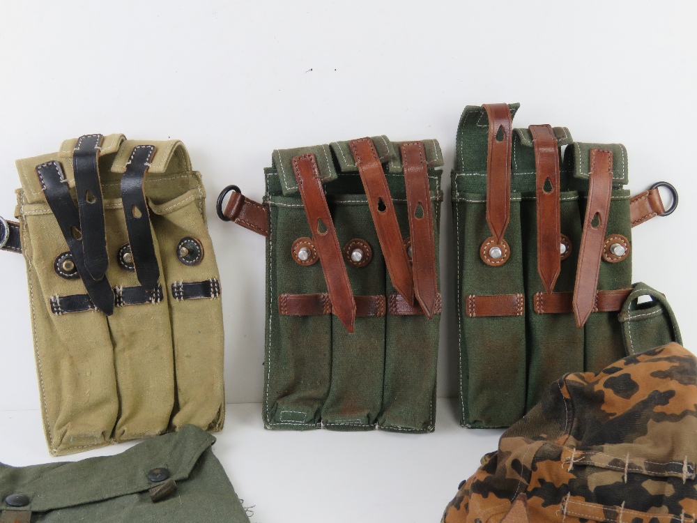 A quantity of assorted reproduction militaria; WWII German MP40 magazine pouches, - Image 2 of 3