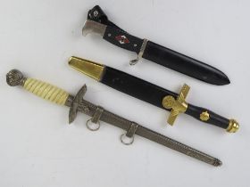 Three reproduction WWII German daggers; Hitler Youth, Officers and a Ceremonial Dagger.