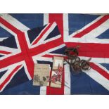A vintage Union Jack fabric flag together with another flag, desktop type flag decorations,