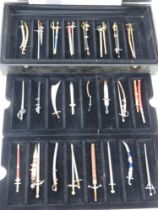 A collection of decorative miniature pewter letter opener sized swords by Mayfair 'Limited Edition