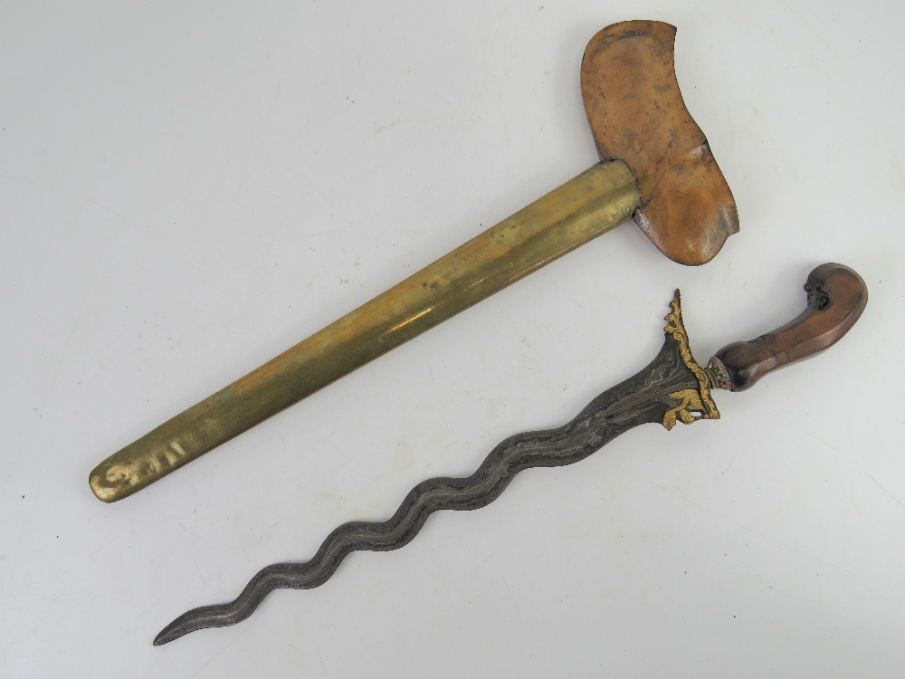 A Kris dagger with scabbard having a gilt gild blade, the hand carved handle set with stones. - Image 2 of 4