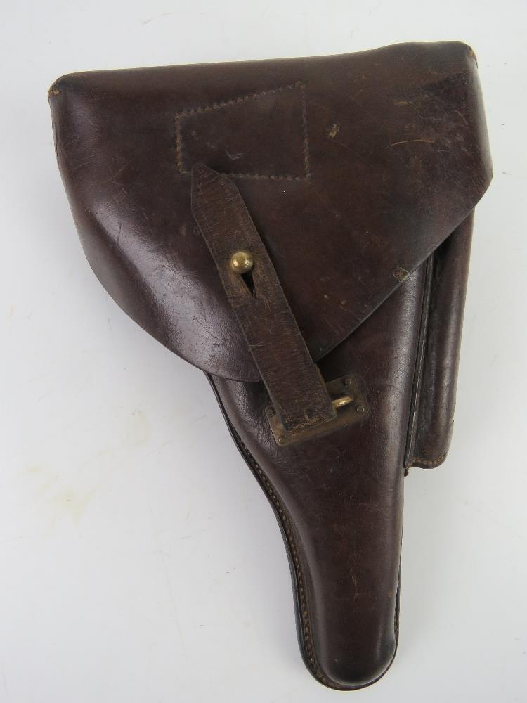 A WWI German Officer's Luger holster, adapted with an extra pouch for a cleaning tool.