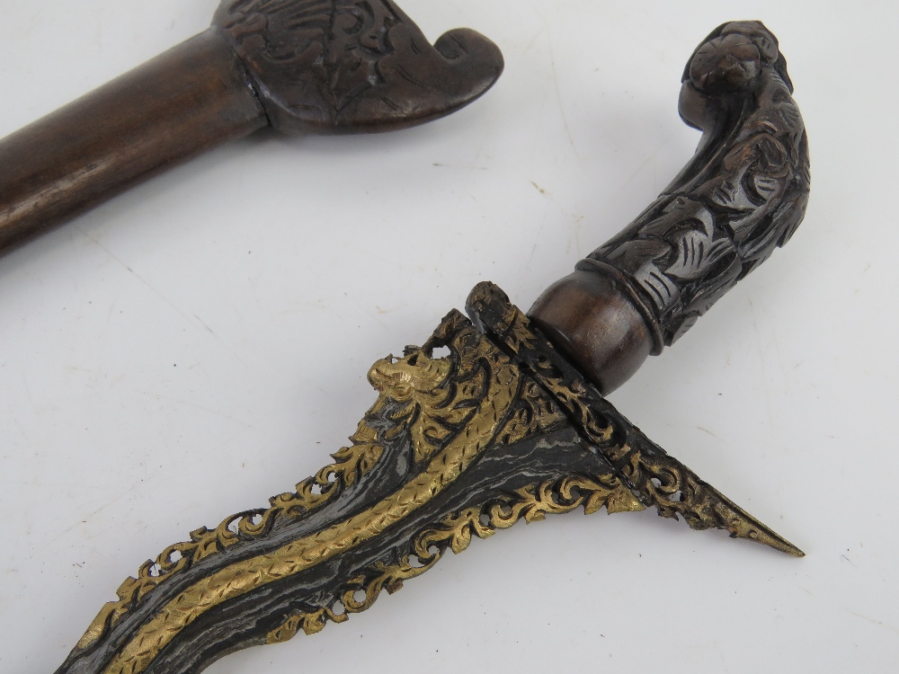 A Kris knife with scabbard having gold gilt blade, with hand crafted and carved scabbard and handle. - Image 3 of 3