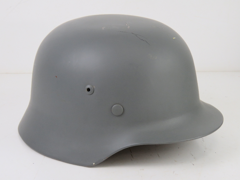 A reproduction M35 helmet with repro Splinter pattern Army helmet cover, liner and chin strap. - Image 2 of 4