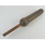 An antique wooden baton.