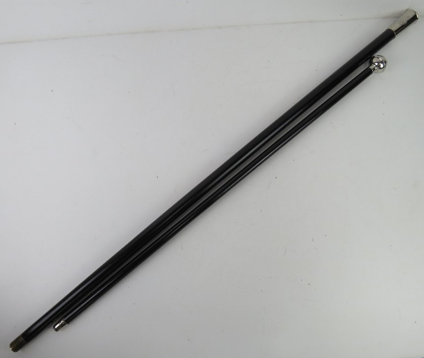 A pair of canes in case measuring 27"" and 36"" respectively.