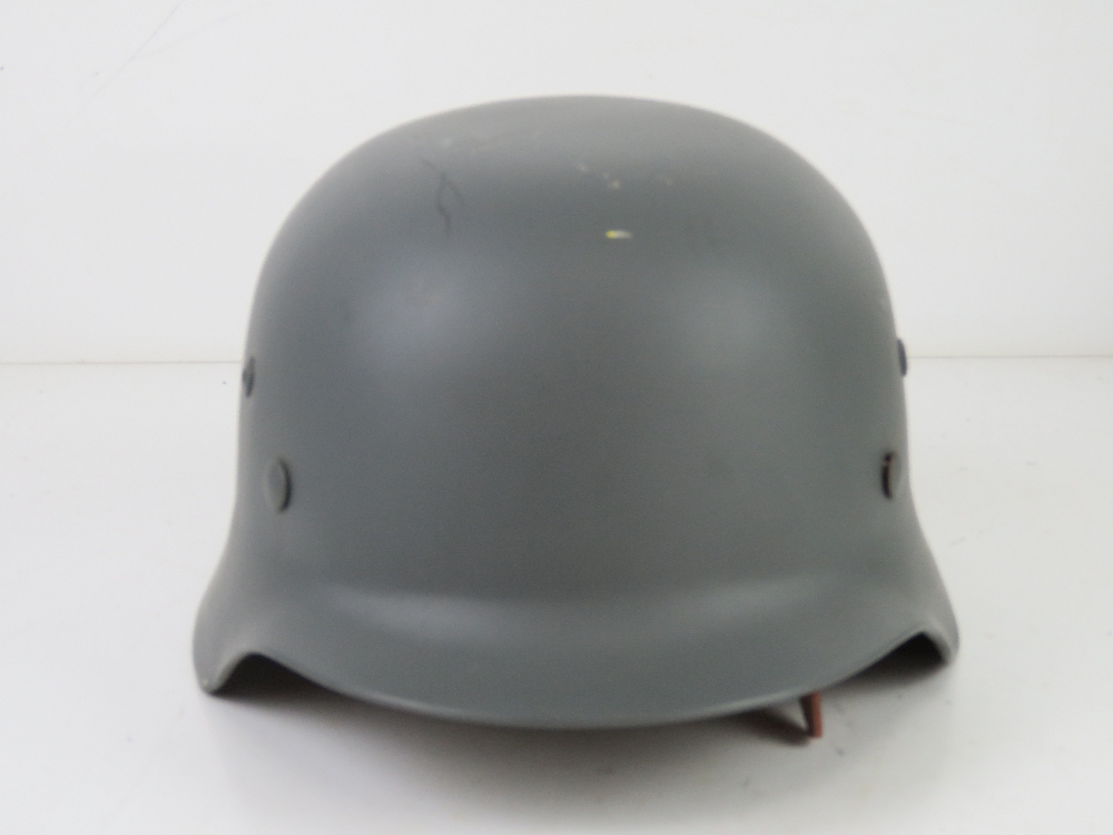 A reproduction M35 helmet with repro Splinter pattern Army helmet cover, liner and chin strap. - Image 3 of 4