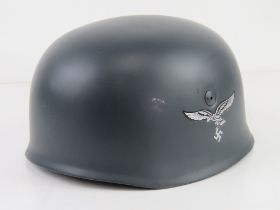 A reproduction WWII German single decal M38 Fallschirmjager helmet, with liner and chin strap.