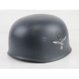 A reproduction WWII German single decal M38 Fallschirmjager helmet, with liner and chin strap.