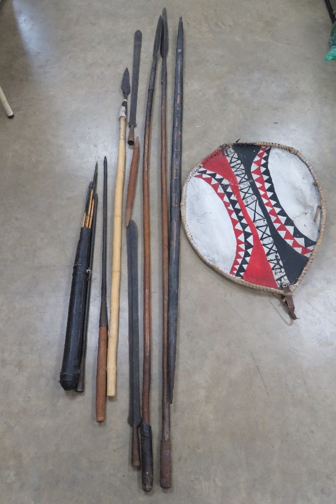 A collection of African items inc four spears, a sword, bow with a bag of six arrows,