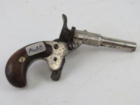 An antique nickel plated German 6mm Blank Calibre Derringer.