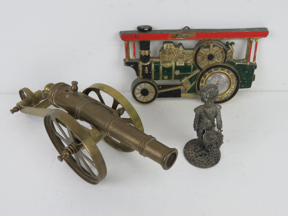 A brass tabletop model of a cannon, approx 10",