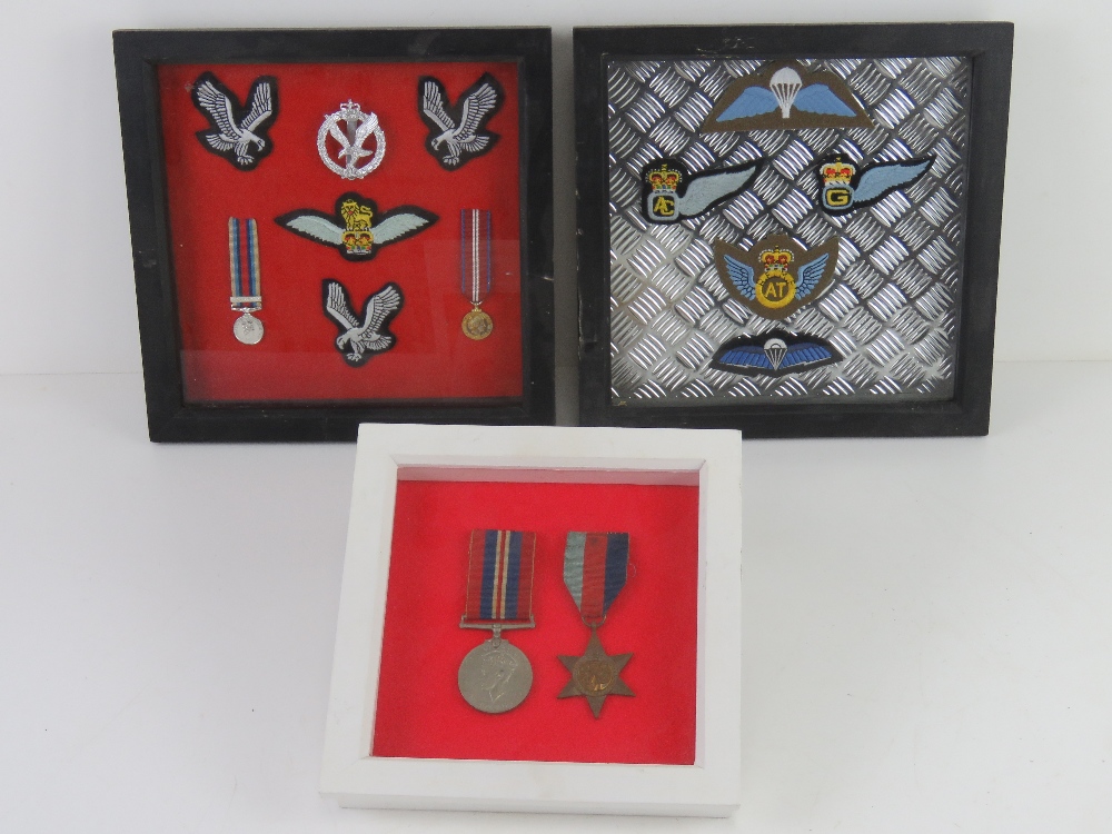 WWII Medals in framed box; 1939-1945 Star with original ribbon, War Medal with original ribbon.