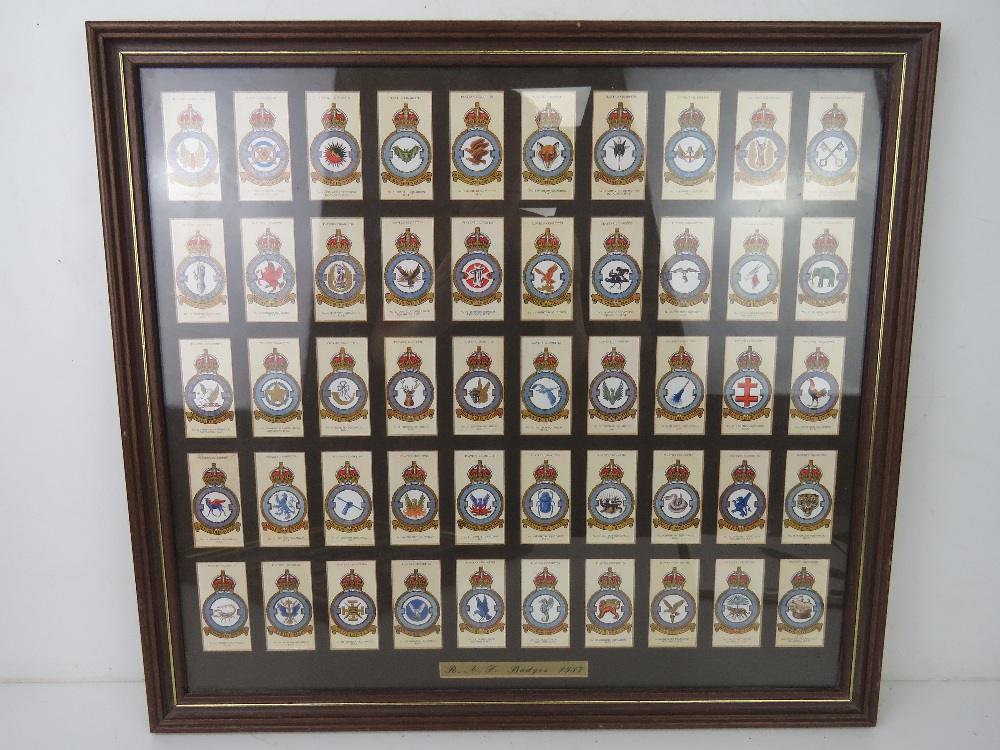 A framed set of Military Regiment themed Players cigarette cards.