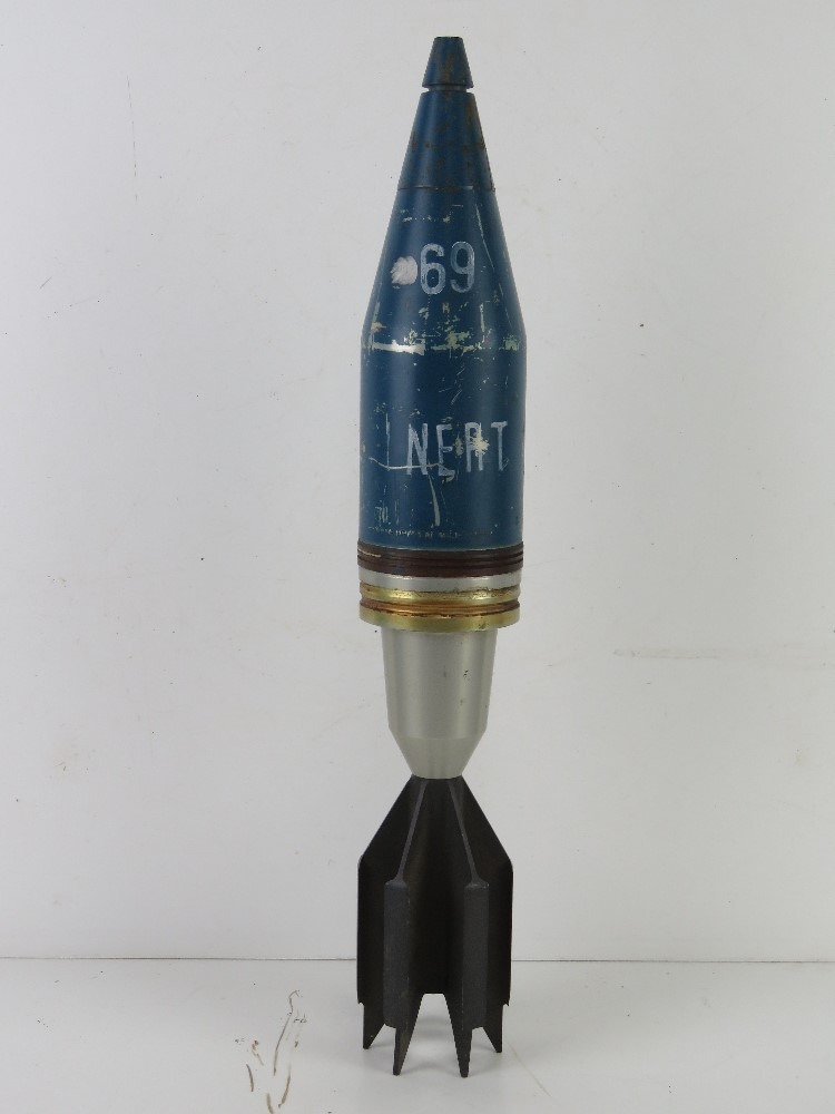 An inert British 90mm NP188 A1 round, dated 82.