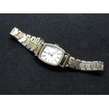 A vintage 9ct gold Omega ladies cocktail watch on Montal gold plated strap, silvered dial,