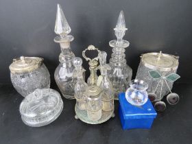 A cut glass and silver plated cruet set together with two cut glass decanters and a quantity of