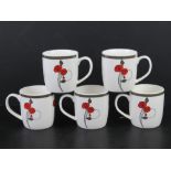 A set of five contemporary mugs having Renee Mackintosh pattern upon.