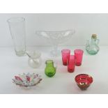 An etched glass vase together with a cut glass pedestal bowl, condiment pot,