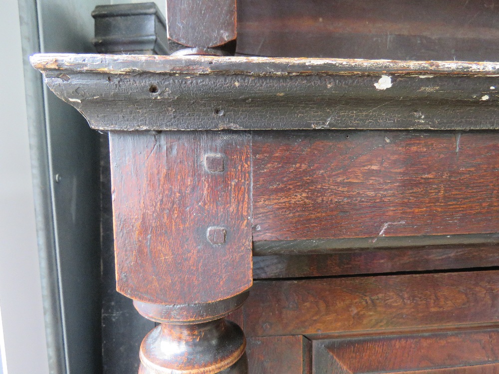 An 18th century oak court style cupboard having central field moulded panel to middle section and - Image 7 of 9