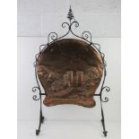 An Arts & Crafts wrought iron and beaten copper fireguard 'Layer Marni Tower Essex' 57cm wide,