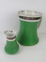 A Bisto England ceramic wash jug with matching bud vase in green and white ground with black floral