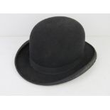 A felted bowler hat by Challenge aperture 7.5 x 6 1/4 approx 6 3/4. Slight a/f.