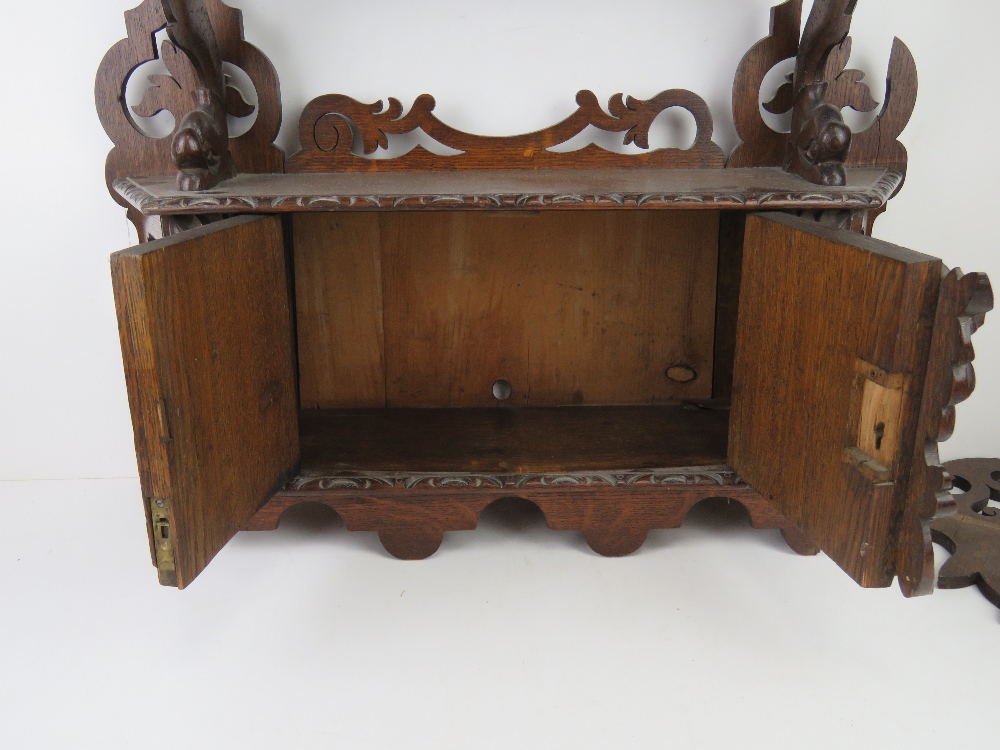 A 19thC carved oak wall hanging smoker's type cabinet. - Image 3 of 4