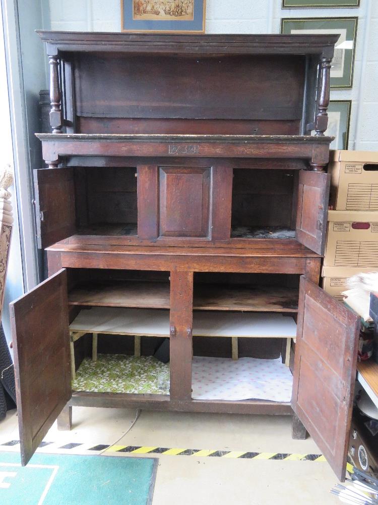 An 18th century oak court style cupboard having central field moulded panel to middle section and - Image 3 of 9