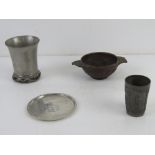 A carved wooden quaich together with a German pewter tot cup,